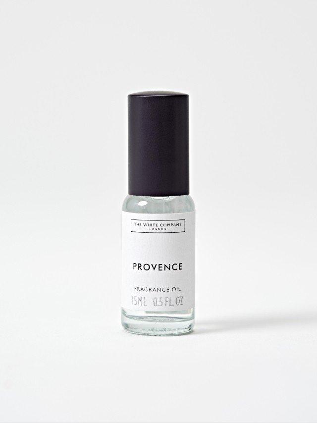 a bottle of perfume with a white label