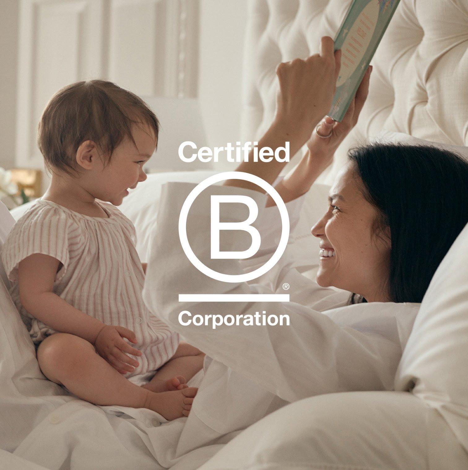 a woman hugging a child with the words certified corporation on the back