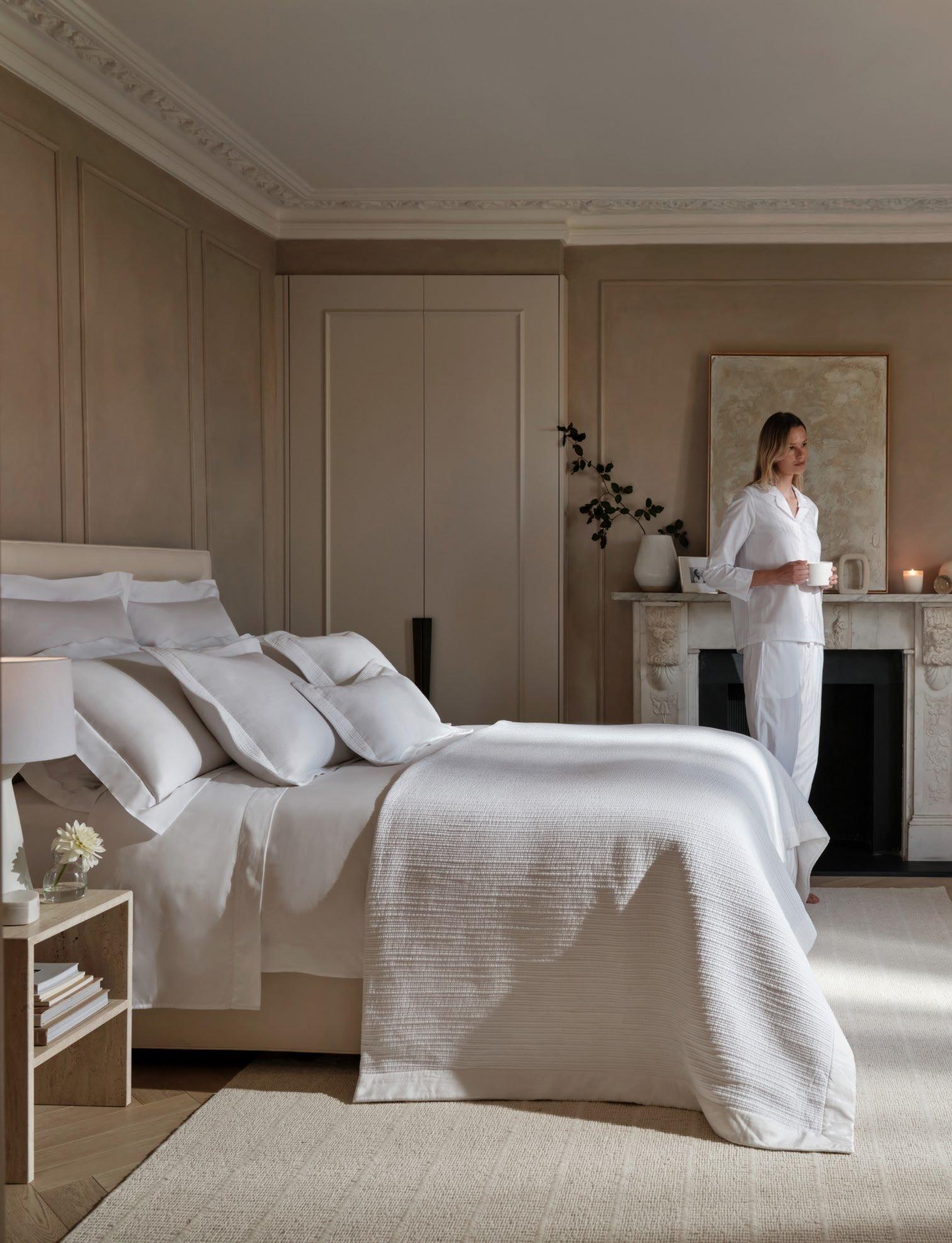 woman walking in to a bedroom