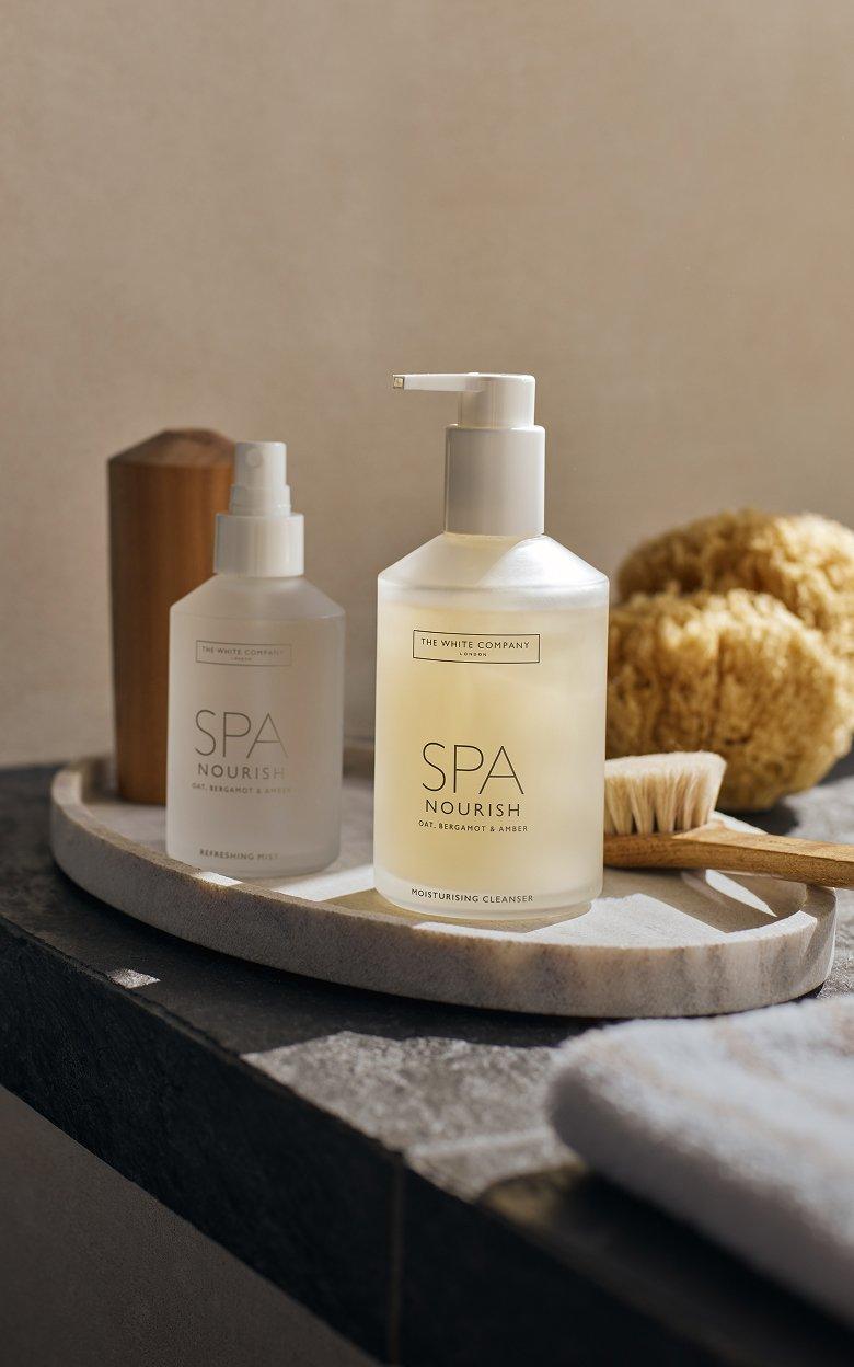 a couple of a couple of bottles of soap sitting on a tray